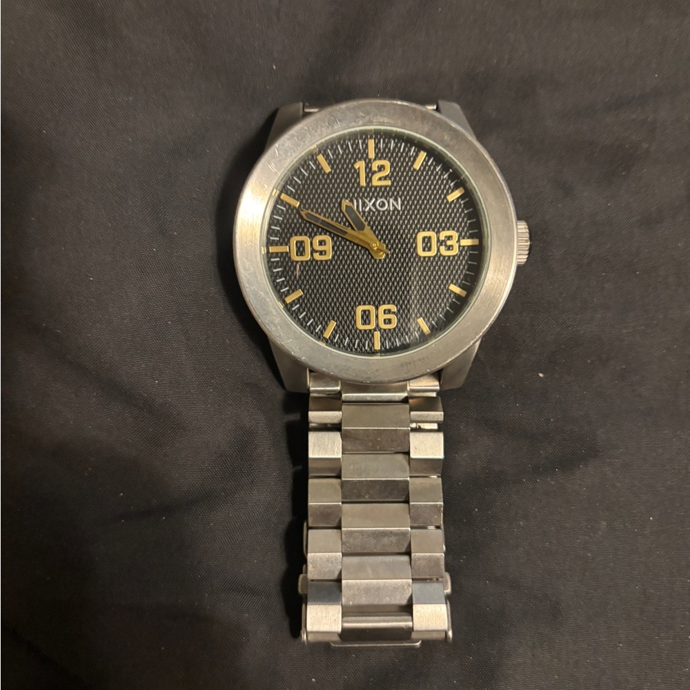 Nixon Silver Watch with Black and Gold Accents